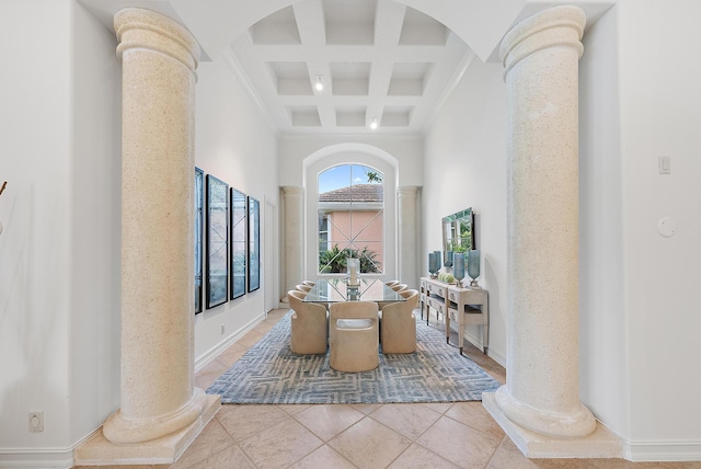 bathroom with beam ceiling, coffered ceiling, decorative columns, and a high ceiling