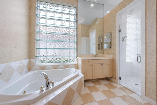 bathroom with vanity and separate shower and tub