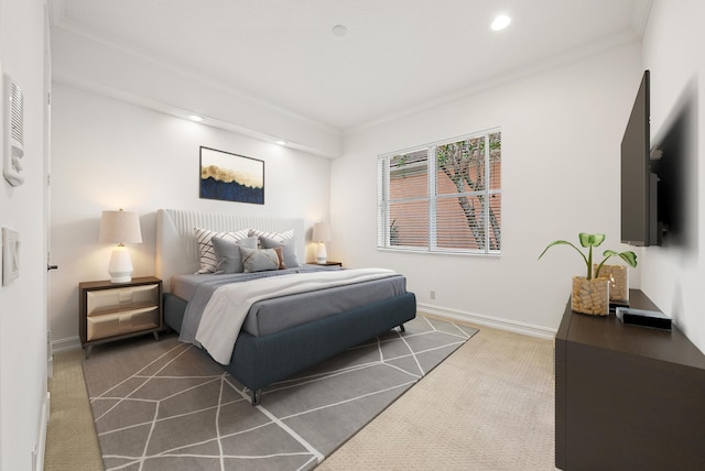 carpeted bedroom with ornamental molding