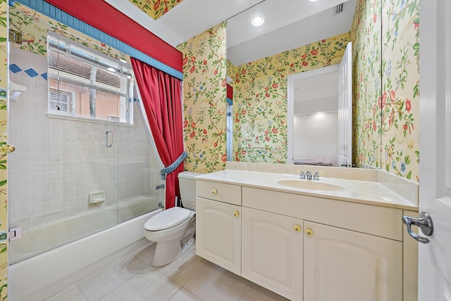 full bathroom with vanity, toilet, shower / bath combination with glass door, and tile patterned flooring