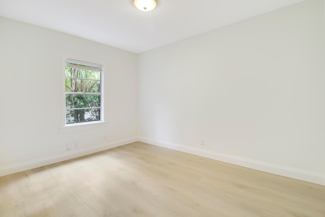 unfurnished room with light wood-type flooring