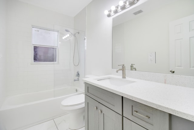 full bathroom with vanity, toilet, and tiled shower / bath combo