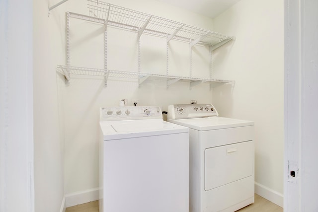 laundry room with separate washer and dryer