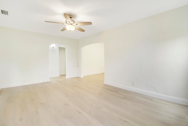 empty room featuring ceiling fan and light hardwood / wood-style floors