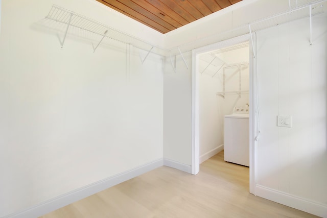 spacious closet featuring wood-type flooring and washer / clothes dryer