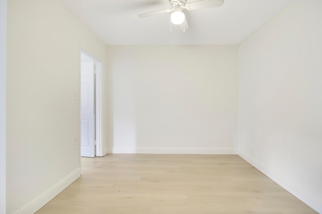 empty room with ceiling fan and light hardwood / wood-style floors