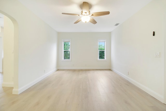 unfurnished room with light hardwood / wood-style flooring and ceiling fan