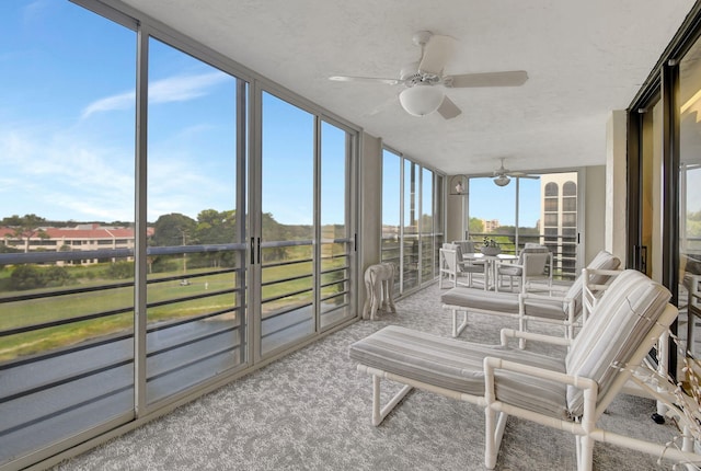 sunroom / solarium with ceiling fan