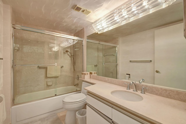 full bathroom featuring toilet, vanity, tile patterned flooring, and shower / bath combination with glass door