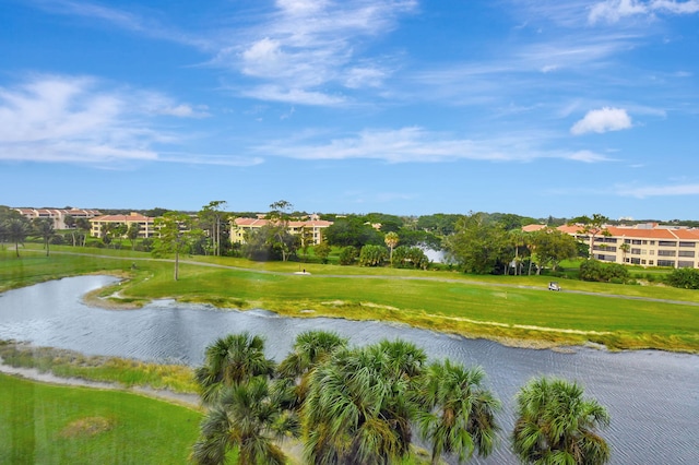 view of home's community featuring a water view and a yard