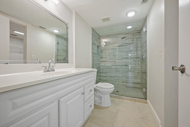 bathroom with walk in shower, vanity, toilet, and tile patterned floors