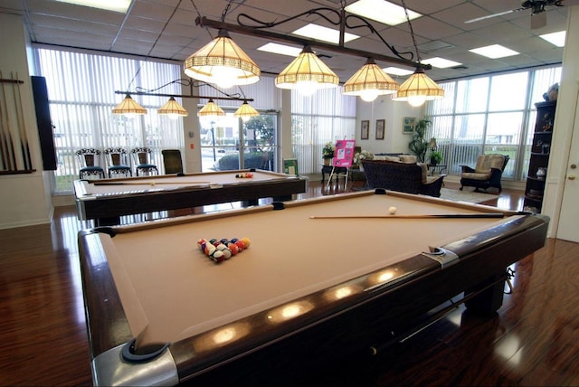 playroom with a healthy amount of sunlight, billiards, a drop ceiling, and wood finished floors