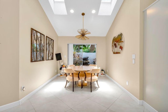 dining space with high vaulted ceiling