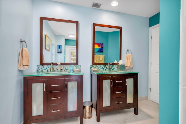 bathroom with tile patterned flooring, backsplash, and vanity