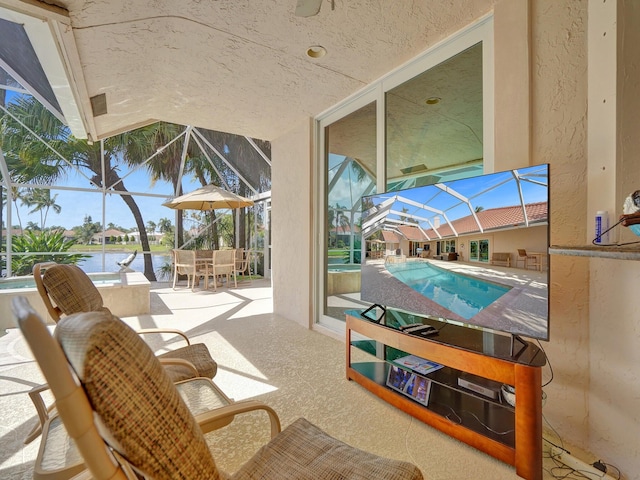 view of patio with glass enclosure