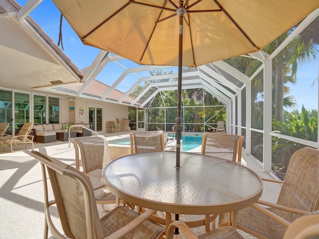 sunroom featuring a swimming pool and vaulted ceiling