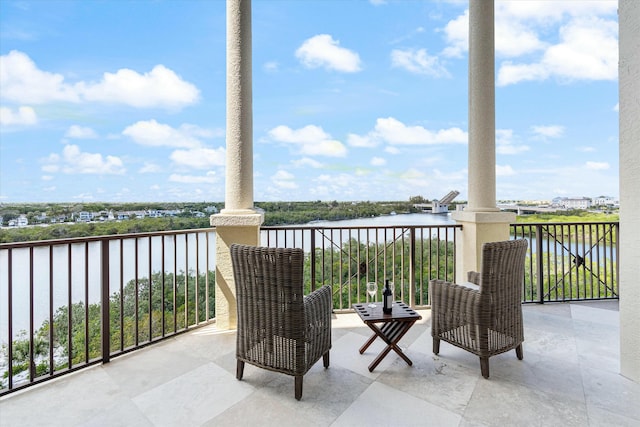 balcony featuring a water view