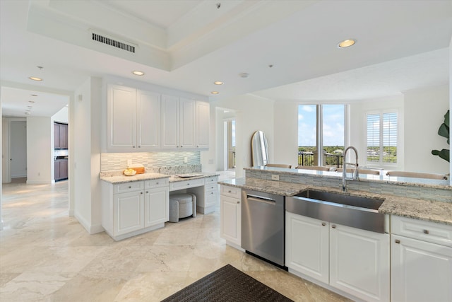 kitchen with a sink, visible vents, stainless steel dishwasher, decorative backsplash, and crown molding