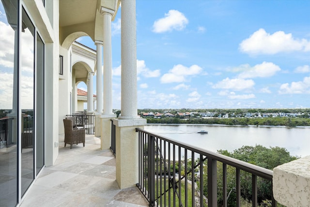 balcony featuring a water view