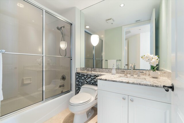 bathroom with a walk in shower and baseboards