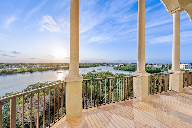 wooden deck with a water view