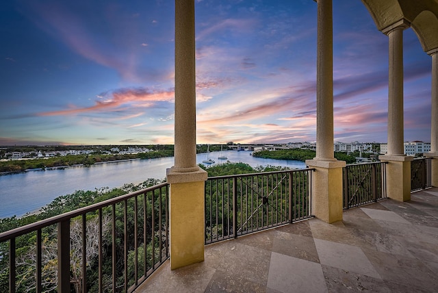 balcony at dusk with a water view