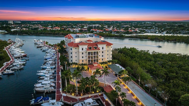 aerial view at dusk with a water view