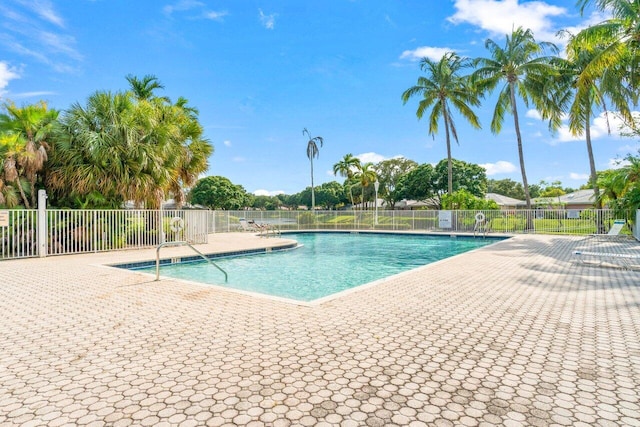 view of swimming pool featuring a patio area