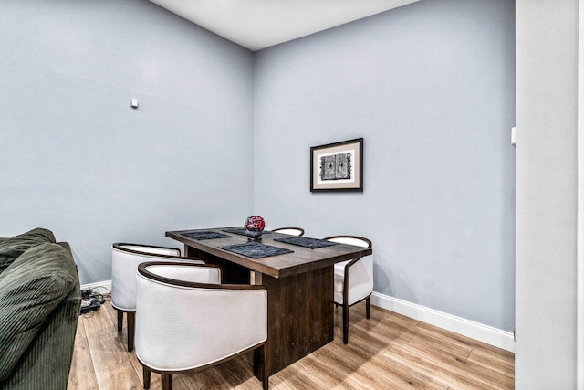 dining area with wood-type flooring