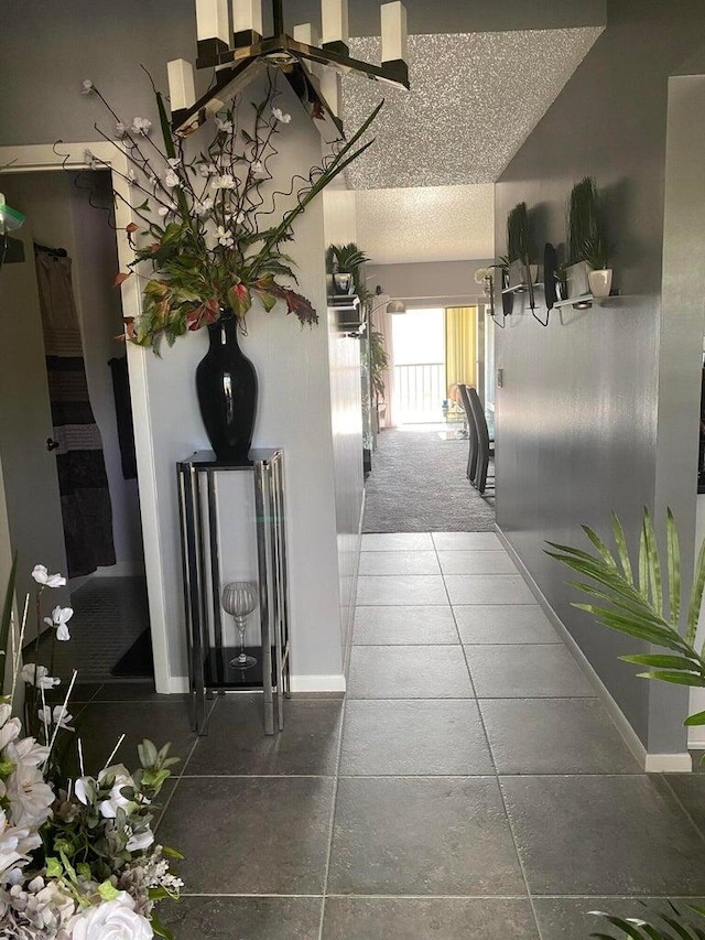 hallway featuring a textured ceiling