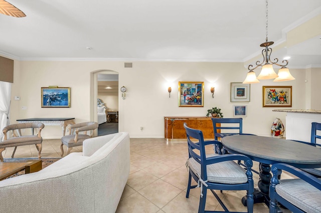 6189 Island Walk Unit A, Boca Raton, FL 33496 - dining area with visible vents, crown molding, arched walkways, light tile patterned floors, and baseboards