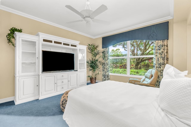 carpeted bedroom with ornamental molding and ceiling fan