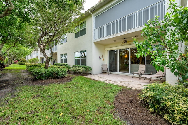 6189 Island Walk Unit A, Boca Raton, FL 33496 - back of property featuring a ceiling fan, a patio area, and stucco siding