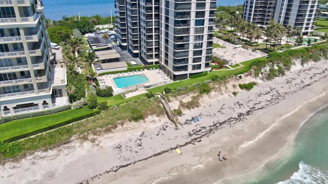 aerial view featuring a water view and a beach view