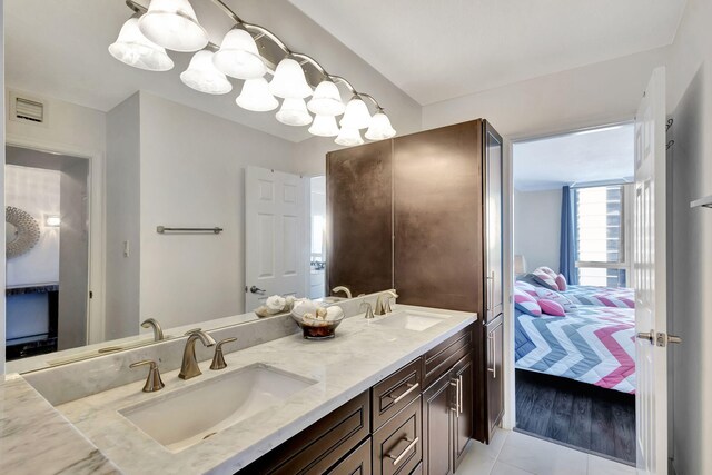 bathroom featuring vanity and tile patterned flooring