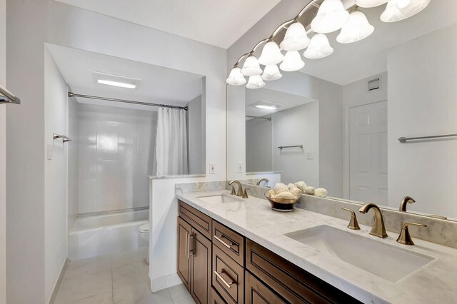 full bathroom featuring toilet, shower / bath combo, vanity, and tile patterned flooring