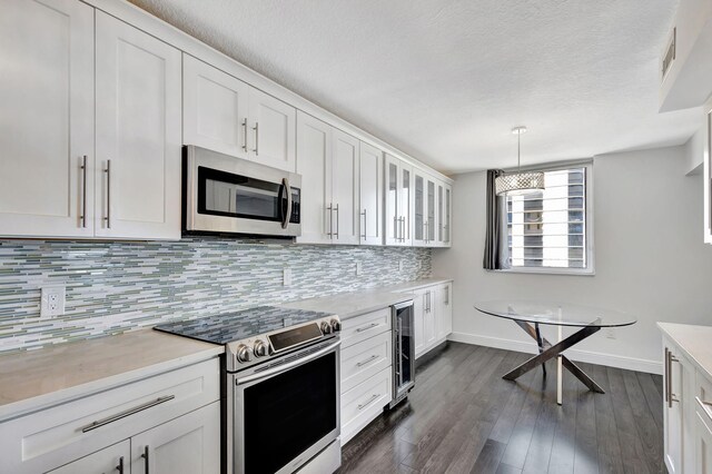 kitchen with appliances with stainless steel finishes and white cabinetry