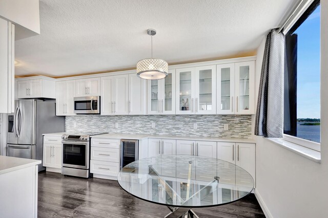 kitchen featuring appliances with stainless steel finishes and white cabinets