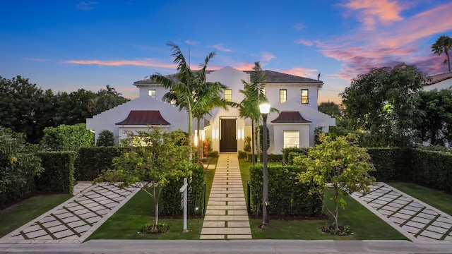 view of front of home with a lawn