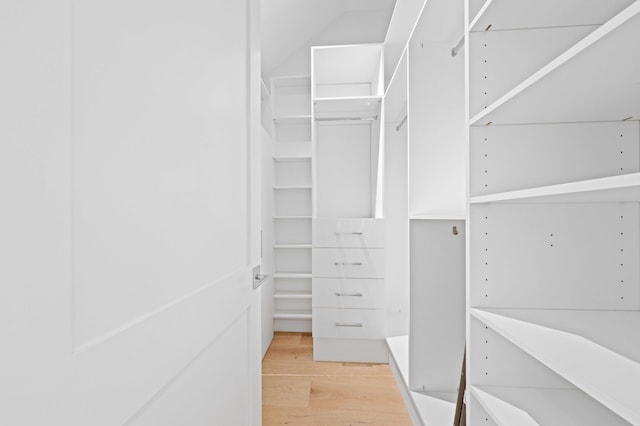 walk in closet featuring light hardwood / wood-style flooring