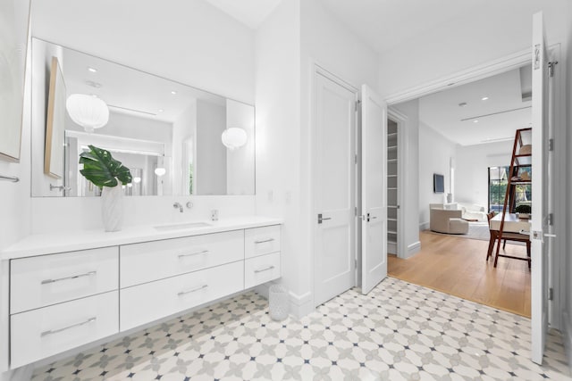 bathroom featuring vanity and wood-type flooring