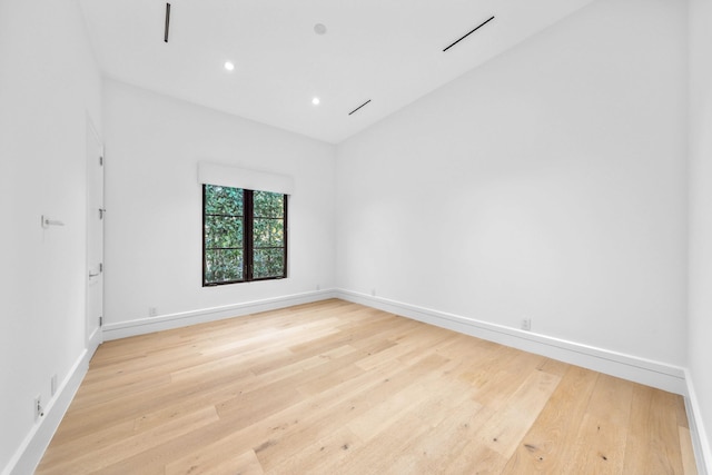 spare room with light hardwood / wood-style flooring