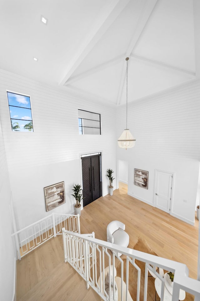 stairway with hardwood / wood-style flooring