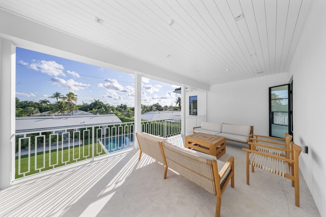 view of patio with a balcony and an outdoor hangout area