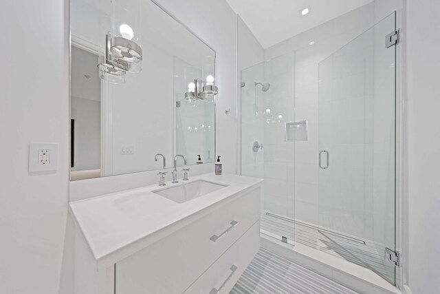 bathroom with vanity, tile patterned floors, and walk in shower