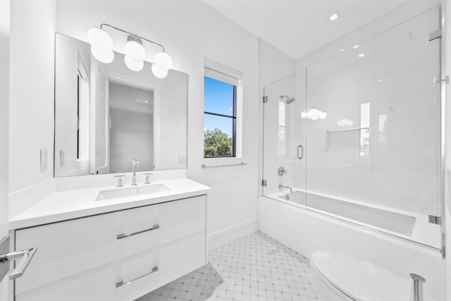 full bathroom with vanity, enclosed tub / shower combo, and toilet