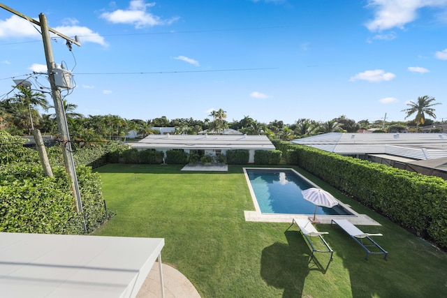 view of pool featuring a lawn and a patio area