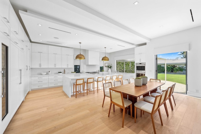 dining area with light hardwood / wood-style floors