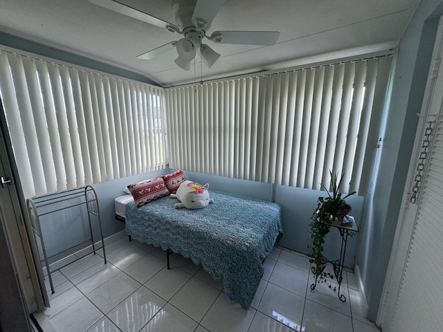 bedroom with tile patterned floors and a ceiling fan