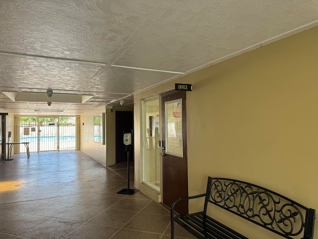 corridor with a textured ceiling